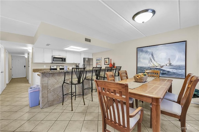 110 Verna Jean Dr Unit 110, South Padre Island, TX 78597 - dining room with light tile patterned floors