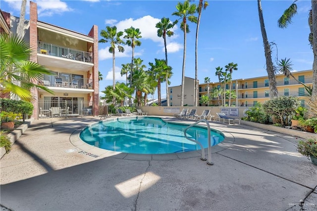 view of swimming pool featuring a patio