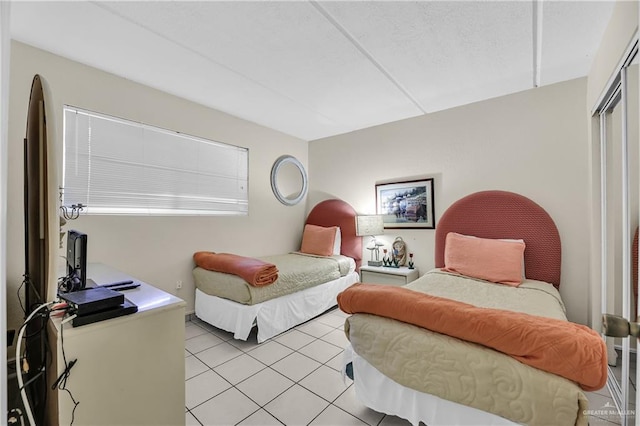 bedroom with light tile patterned flooring