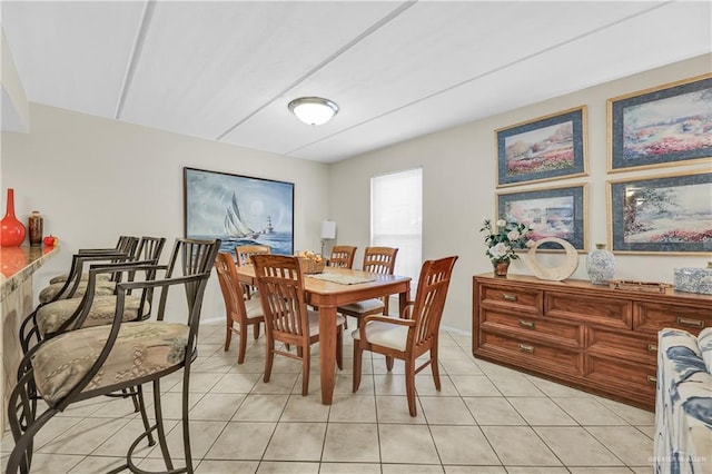 dining room with light tile patterned flooring