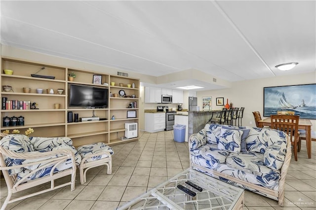 living room featuring light tile patterned floors