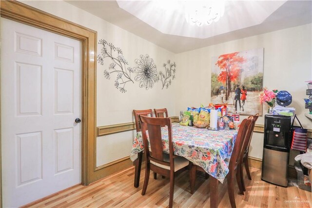 dining area with wood finished floors