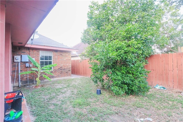 view of yard with a fenced backyard