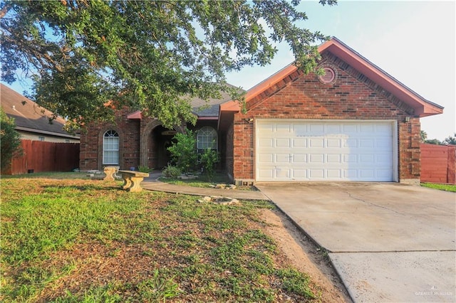 ranch-style house with concrete driveway, a garage, fence, and brick siding