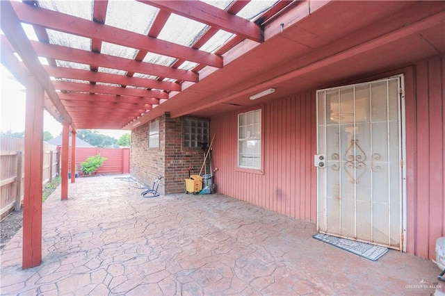 view of patio / terrace featuring a fenced backyard and a pergola