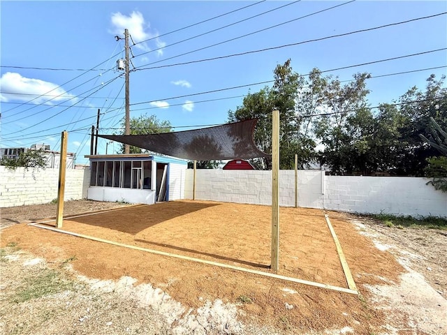 612 E Tom Landry St, Mission, TX 78572 - fenced backyard with a sunroom
