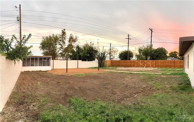 612 E Tom Landry St, Mission, TX 78572 - fenced backyard featuring a sunroom