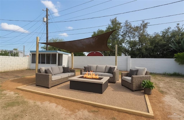 612 E Tom Landry St, Mission, TX 78572 - fenced backyard with an outdoor living space with a fire pit, a patio area, and a sunroom