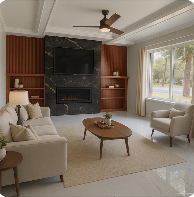 612 E Tom Landry St, Mission, TX 78572 - living room featuring ceiling fan, a fireplace, crown molding, and beam ceiling