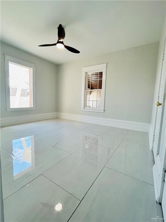 612 E Tom Landry St, Mission, TX 78572 - spare room with plenty of natural light and a ceiling fan
