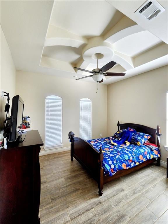 bedroom with ceiling fan and light hardwood / wood-style floors