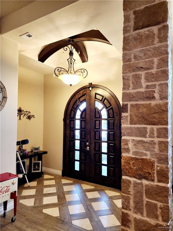 entryway featuring french doors