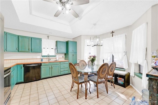 kitchen with sink, hanging light fixtures, electric range, black dishwasher, and a tray ceiling