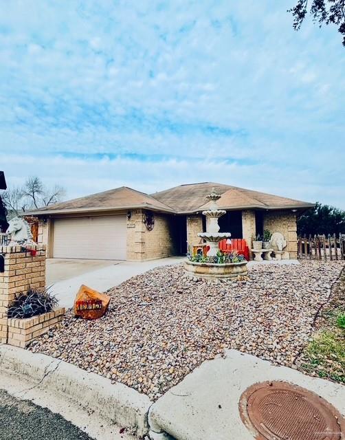 single story home with a garage