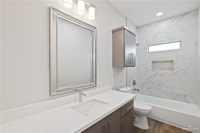 556 Candela St, Edinburg, TX 78542 - bathroom with vanity, shower / bathtub combination, and wood finished floors