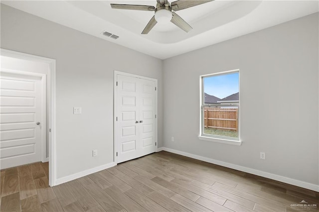 556 Candela St, Edinburg, TX 78542 - unfurnished bedroom with light wood-style floors, a closet, and ceiling fan