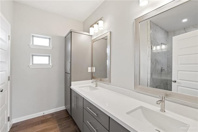 556 Candela St, Edinburg, TX 78542 - full bath featuring double vanity, wood finished floors, and a marble finish shower