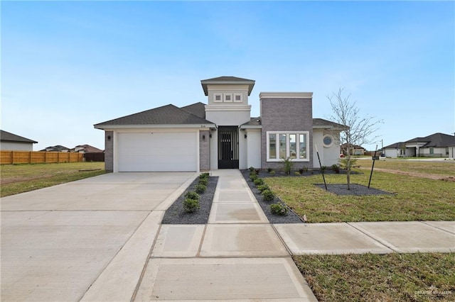 556 Candela St, Edinburg, TX 78542 - view of front facade featuring an attached garage, driveway, and stucco siding