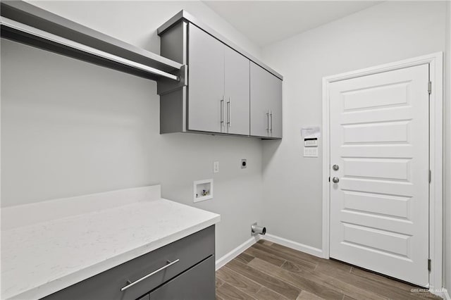 556 Candela St, Edinburg, TX 78542 - laundry area with hookup for an electric dryer, cabinet space, dark wood-style floors, and washer hookup
