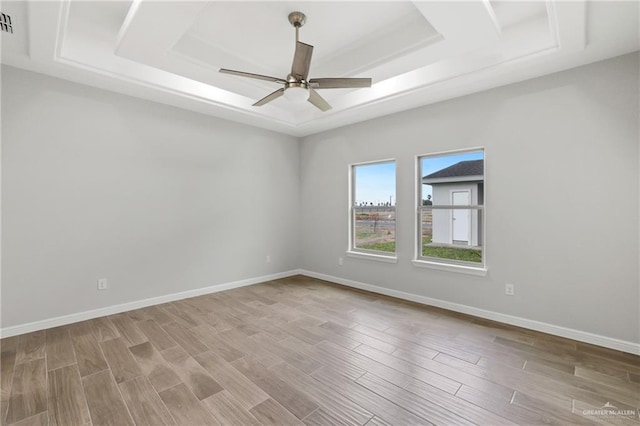 556 Candela St, Edinburg, TX 78542 - spare room with a raised ceiling, a ceiling fan, and wood finished floors