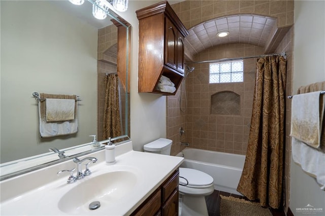 full bathroom featuring vanity, toilet, and shower / bath combo with shower curtain