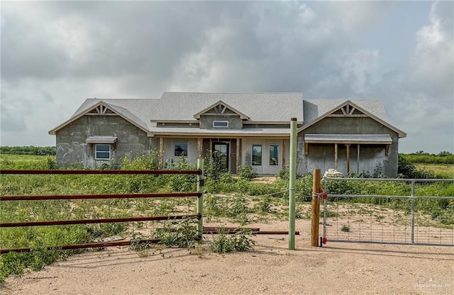 view of front of home featuring a gate and fence