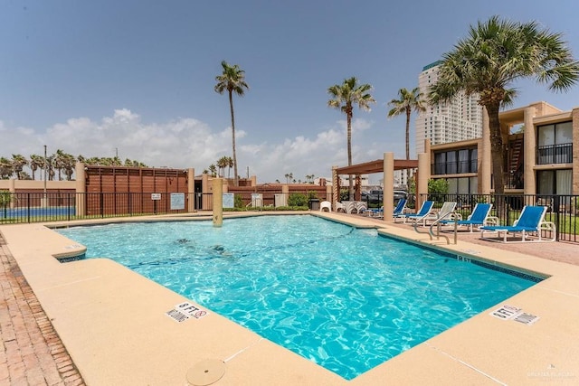 110 Padre Blvd Unit 603, South Padre Island, TX 78597 - community pool with a patio and fence