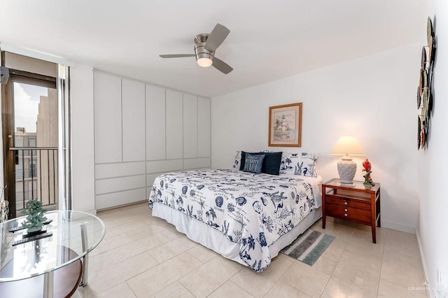 110 Padre Blvd Unit 603, South Padre Island, TX 78597 - bedroom with light tile patterned floors and a ceiling fan