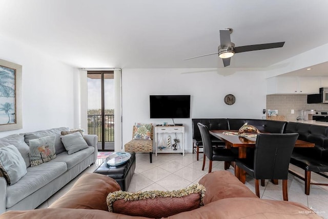110 Padre Blvd Unit 603, South Padre Island, TX 78597 - living area featuring a wall of windows, light tile patterned flooring, and ceiling fan