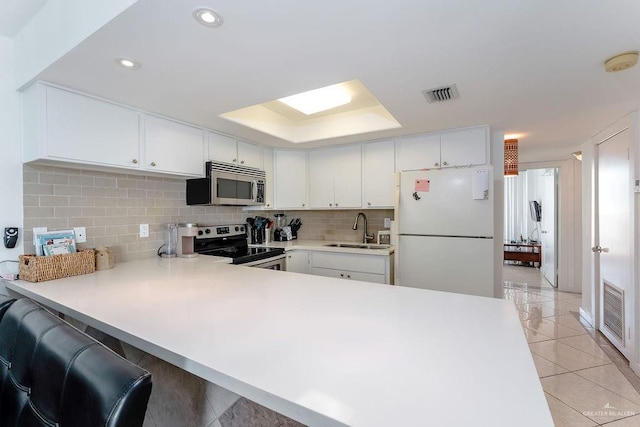 110 Padre Blvd Unit 603, South Padre Island, TX 78597 - kitchen featuring a sink, stainless steel appliances, visible vents, and light countertops