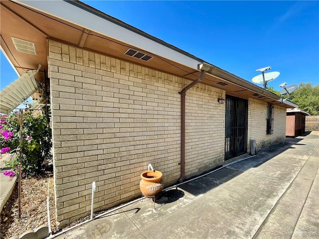 view of property exterior with a patio