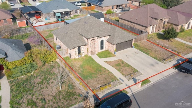 birds eye view of property with a residential view