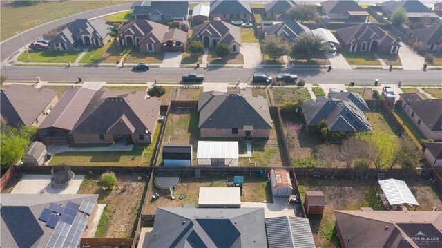 birds eye view of property with a residential view