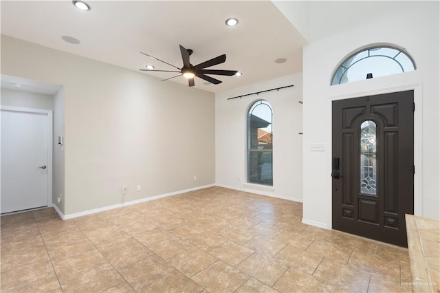 foyer featuring recessed lighting, ceiling fan, and baseboards