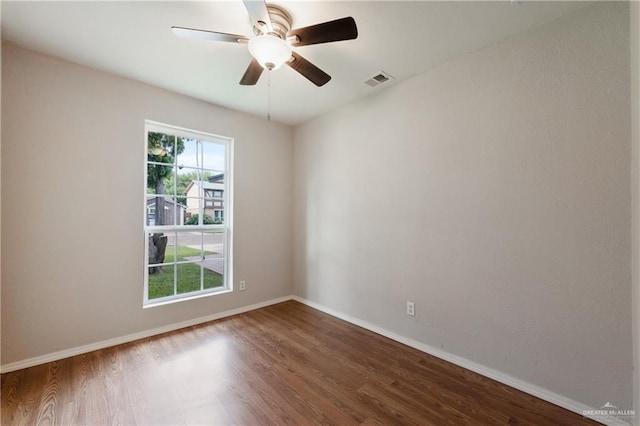 2310 Arbor St, Harlingen, TX 78552 - unfurnished room with dark wood-style floors, baseboards, and ceiling fan