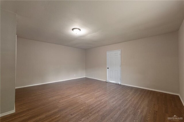 2310 Arbor St, Harlingen, TX 78552 - unfurnished room with dark wood finished floors and baseboards