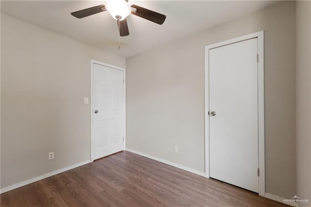 2310 Arbor St, Harlingen, TX 78552 - unfurnished bedroom featuring wood finished floors, baseboards, and ceiling fan