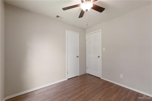 2310 Arbor St, Harlingen, TX 78552 - unfurnished room with wood finished floors, baseboards, and ceiling fan