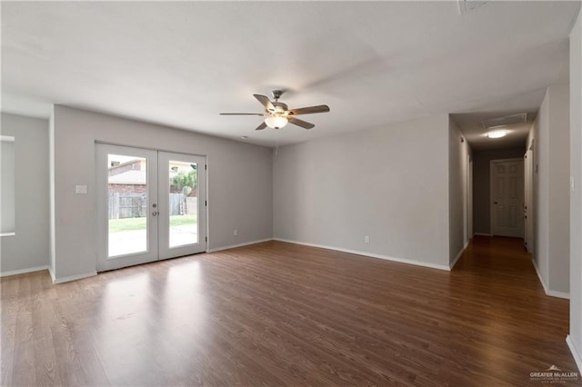 2310 Arbor St, Harlingen, TX 78552 - spare room featuring french doors, wood finished floors, baseboards, and ceiling fan