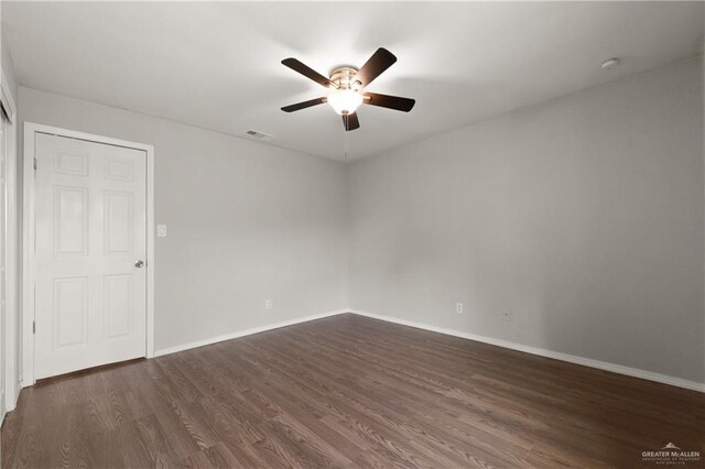 2310 Arbor St, Harlingen, TX 78552 - unfurnished room with ceiling fan, dark wood-type flooring, and baseboards