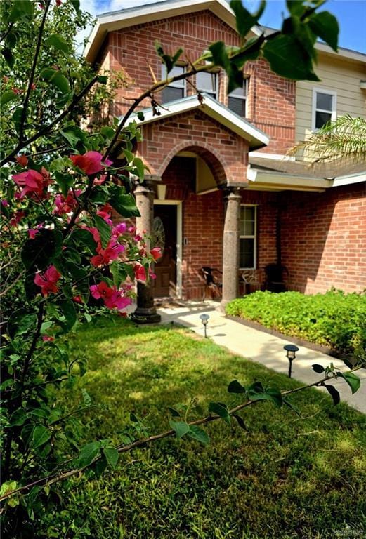 1920 Katherine Ave, Edinburg, TX 78539 - entrance to property featuring brick siding and a lawn