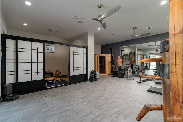 exercise room with ceiling fan