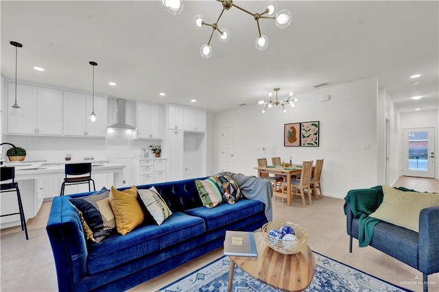 living area with recessed lighting, a notable chandelier, and baseboards