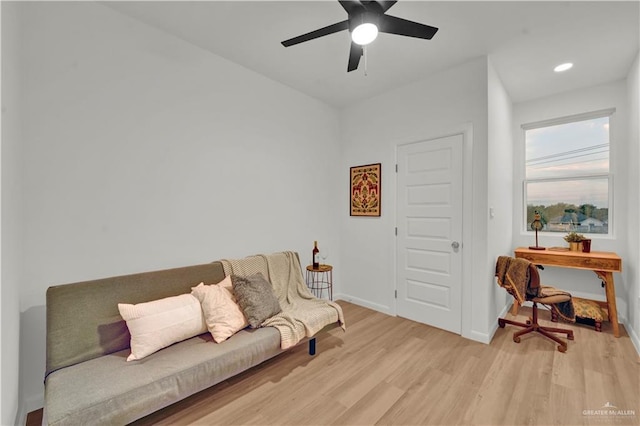 living room with a ceiling fan, recessed lighting, light wood-style flooring, and baseboards