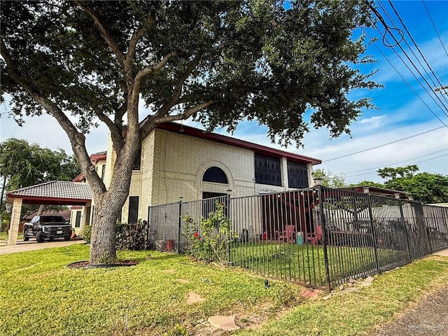 1712 N 1st St, Mcallen, TX 78501 - view of side of property with a lawn, fence, a carport, and brick siding