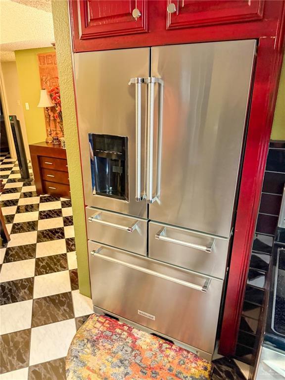 1712 N 1st St, Mcallen, TX 78501 - room details with dark brown cabinets and high end fridge