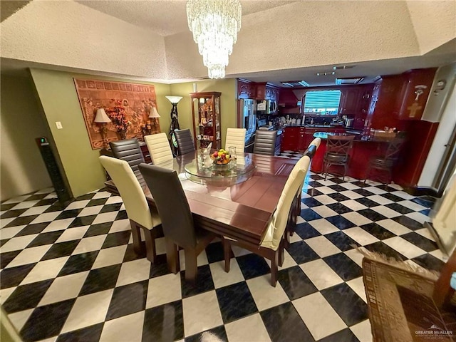 1712 N 1st St, Mcallen, TX 78501 - dining area with a chandelier and a textured ceiling