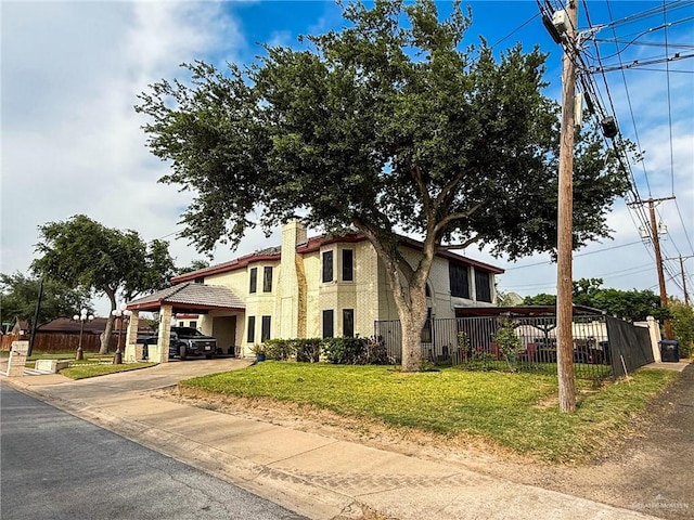 1712 N 1st St, Mcallen, TX 78501 - view of front facade featuring a carport, a chimney, a front lawn, and fence