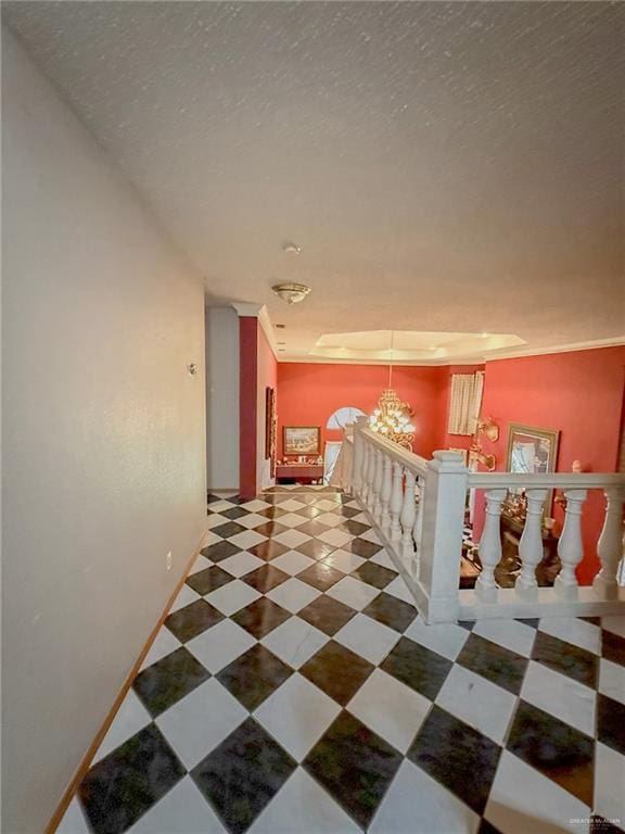 1712 N 1st St, Mcallen, TX 78501 - hallway with an inviting chandelier, a textured ceiling, and an upstairs landing