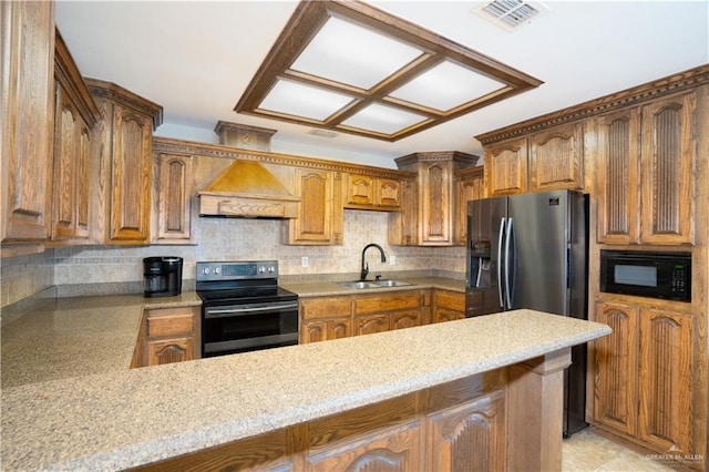 kitchen with premium range hood, a sink, visible vents, fridge with ice dispenser, and stainless steel electric stove